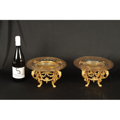 775 - FERDINAND BARBEDIENNE. AN UNUSUAL SET OF EIGHT19TH CENTURY ORMOLU TABLE COMPORTS with gilt edged gla... 