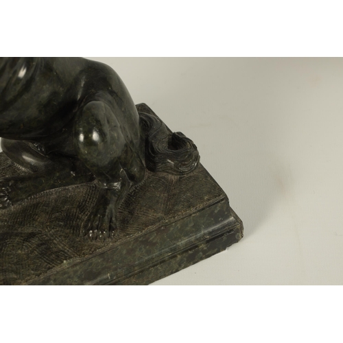 780 - A 19TH CENTURY FRENCH CARVED GREEN MARBLE SCULPTURE OF A SEATED DOG finely executed and set on a mou... 