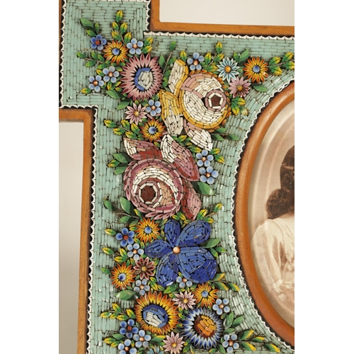 781 - A LARGE VENETIAN MICRO MOSAIC AND SATINWOOD PHOTOGRAPH FRAME having floral decoration and oval panel... 