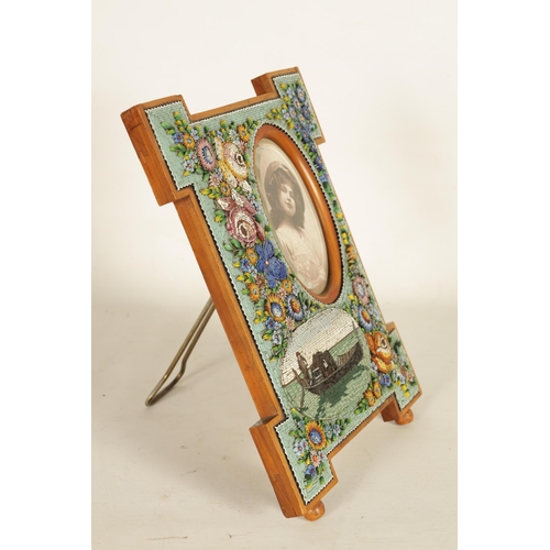 781 - A LARGE VENETIAN MICRO MOSAIC AND SATINWOOD PHOTOGRAPH FRAME having floral decoration and oval panel... 