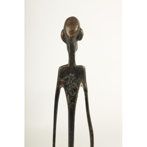 784 - A LATE 19TH/EARLY 20TH CENTURY BENIN STYLE BRONZE FIGURE on square moulded base (44cm high )