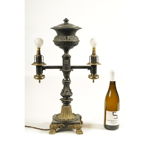 786 - A REGENCY BRONZE AND ORMOLU TABLE LAMP with acanthus leaf mouldings and masked centre raised on a sq... 