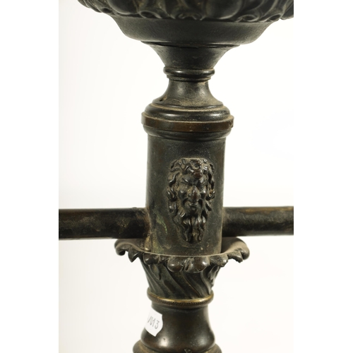 786 - A REGENCY BRONZE AND ORMOLU TABLE LAMP with acanthus leaf mouldings and masked centre raised on a sq... 