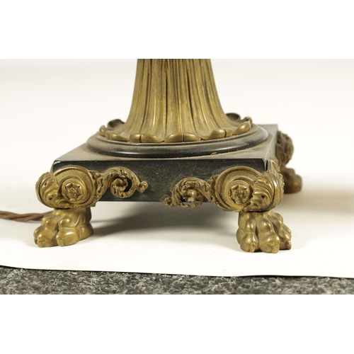 786 - A REGENCY BRONZE AND ORMOLU TABLE LAMP with acanthus leaf mouldings and masked centre raised on a sq... 