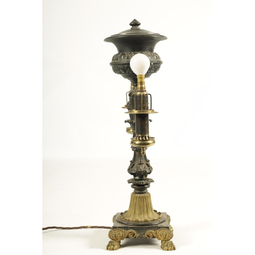 786 - A REGENCY BRONZE AND ORMOLU TABLE LAMP with acanthus leaf mouldings and masked centre raised on a sq... 