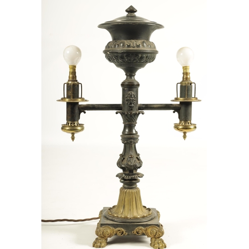 786 - A REGENCY BRONZE AND ORMOLU TABLE LAMP with acanthus leaf mouldings and masked centre raised on a sq... 