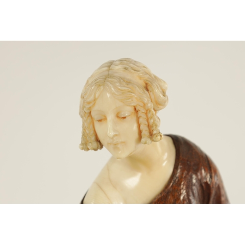 787 - LEONIE BOEHM-HENNES. AN ART NOUVEAU MIXED MEDIA WALNUT AND IVORY CARVED SCULPTURE OF A YOUNG LADY th... 