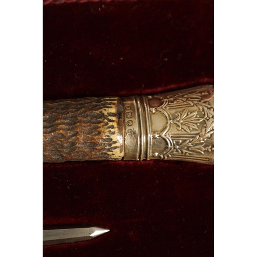 790 - A LATE 19TH CENTURY BOXED SILVER MOUNTED STAG HORN CARVING SET the inlaid oak case with velvet and s... 