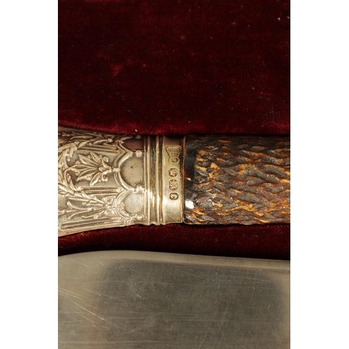 790 - A LATE 19TH CENTURY BOXED SILVER MOUNTED STAG HORN CARVING SET the inlaid oak case with velvet and s... 