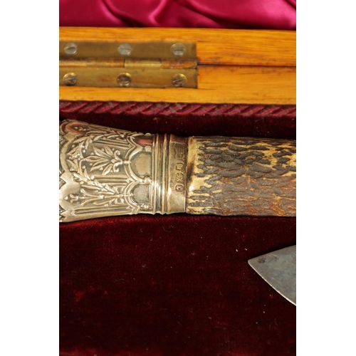 790 - A LATE 19TH CENTURY BOXED SILVER MOUNTED STAG HORN CARVING SET the inlaid oak case with velvet and s... 