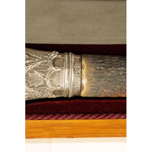 790 - A LATE 19TH CENTURY BOXED SILVER MOUNTED STAG HORN CARVING SET the inlaid oak case with velvet and s... 