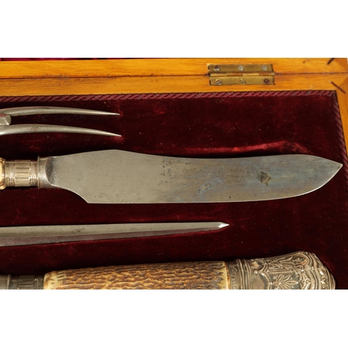 790 - A LATE 19TH CENTURY BOXED SILVER MOUNTED STAG HORN CARVING SET the inlaid oak case with velvet and s... 