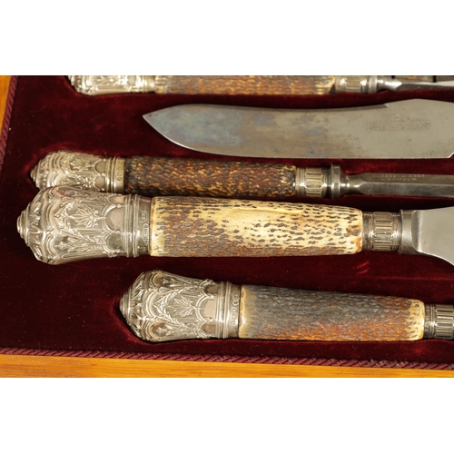 790 - A LATE 19TH CENTURY BOXED SILVER MOUNTED STAG HORN CARVING SET the inlaid oak case with velvet and s... 