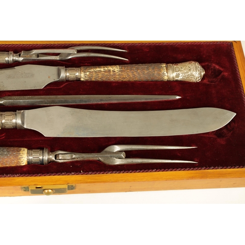 790 - A LATE 19TH CENTURY BOXED SILVER MOUNTED STAG HORN CARVING SET the inlaid oak case with velvet and s... 