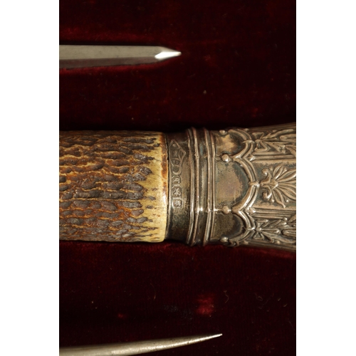 790 - A LATE 19TH CENTURY BOXED SILVER MOUNTED STAG HORN CARVING SET the inlaid oak case with velvet and s... 