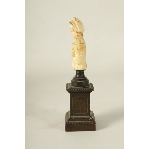 791 - A 19TH CENTURY FRENCH BRONZE AND BONE CARVED SCULPTURE Modelled as Napoleon Bonaparte raised on a pa... 