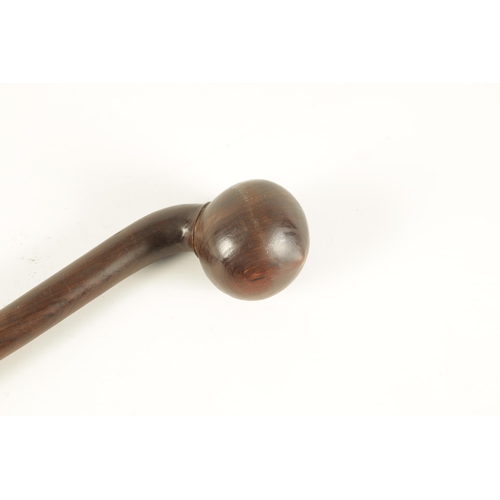 792 - A 19TH CENTURY AFRICAN ROSEWOOD ZULU FIGHTING CLUB the bulbous head with shallow point on a slightly... 