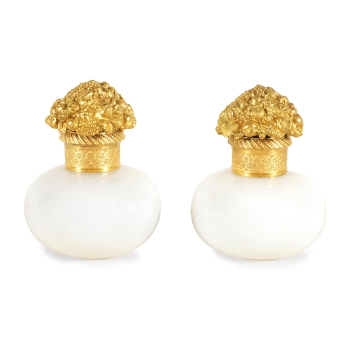 793 - A PAIR OF EARLY 19TH CENTURY FRENCH ORMOLU MOUNTED WHITE OPALINE GLASS PERFUME BOTTLES of bulbous fo... 