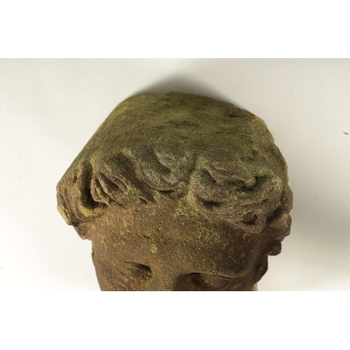 794 - AN EARLY ROMANESQUE STYLE CARVED STONE HEAD (33cm high )