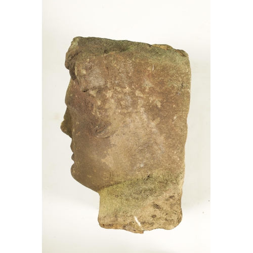 794 - AN EARLY ROMANESQUE STYLE CARVED STONE HEAD (33cm high )