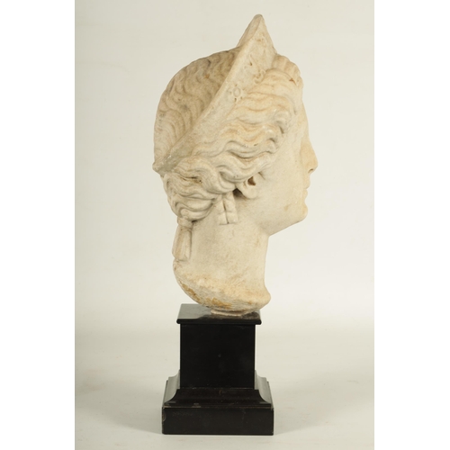 796 - AN INTERESTING 18TH CENTURY ITALIAN CARVED MARBLE HEAD OF A GODDESS mounted on a later black slate s... 