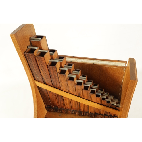 10 - A GOOD QUALITY PORTATIVE ORGAN made by P.D. Collins, the shaped oak frame with moulded edge containi... 