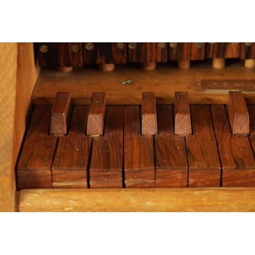 10 - A GOOD QUALITY PORTATIVE ORGAN made by P.D. Collins, the shaped oak frame with moulded edge containi... 