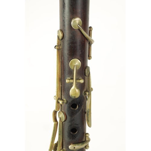 100 - A VINTAGE ROSEWOOD BESSON CLARINET with metal mounts to the bell and banded decoration to each secti... 