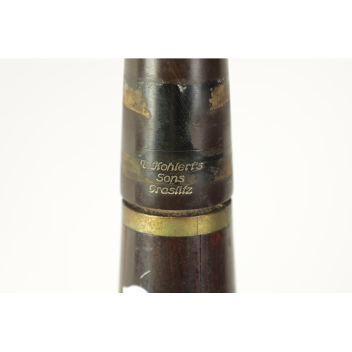 100 - A VINTAGE ROSEWOOD BESSON CLARINET with metal mounts to the bell and banded decoration to each secti... 