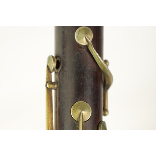 100 - A VINTAGE ROSEWOOD BESSON CLARINET with metal mounts to the bell and banded decoration to each secti... 