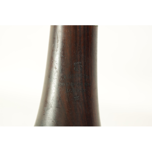 100 - A VINTAGE ROSEWOOD BESSON CLARINET with metal mounts to the bell and banded decoration to each secti... 