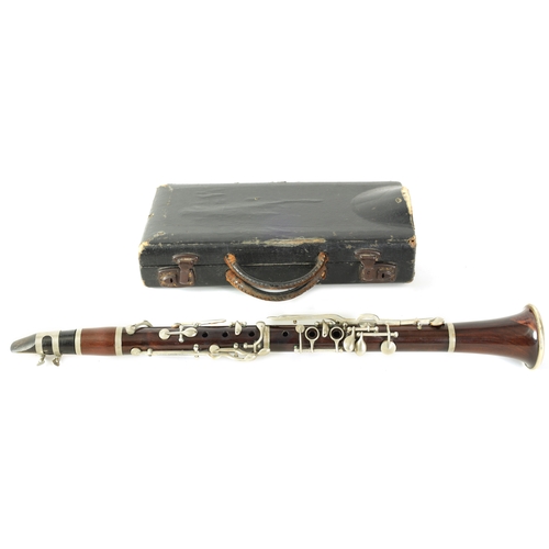 102 - A VINTAGE ROSEWOOD CLARINET with silvered fittings and banded mounts in fitted blue velvet-lined lea... 