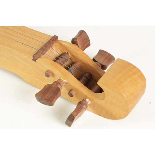 103 - A GERMAN MAPLE SCHEITHOLT an ancestor of the modern Zither, having four strings with pierced sound h... 