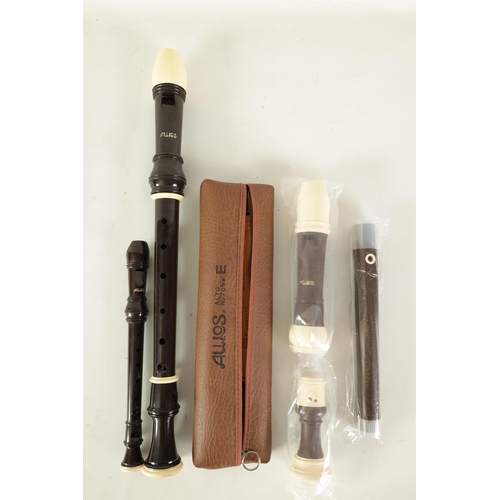 104 - A COLLECTION OF FOUR AULOS RECORDERS To include an unused alto recorder, a tenor recorder, another a... 