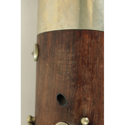 106 - AN EARLY 20TH CENTURY HAWKES & SON LONDON, EXCELSIOR SONORUS CLASS HARDWOOD BASSOON numbered 15491 L... 