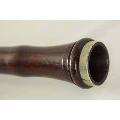 106 - AN EARLY 20TH CENTURY HAWKES & SON LONDON, EXCELSIOR SONORUS CLASS HARDWOOD BASSOON numbered 15491 L... 