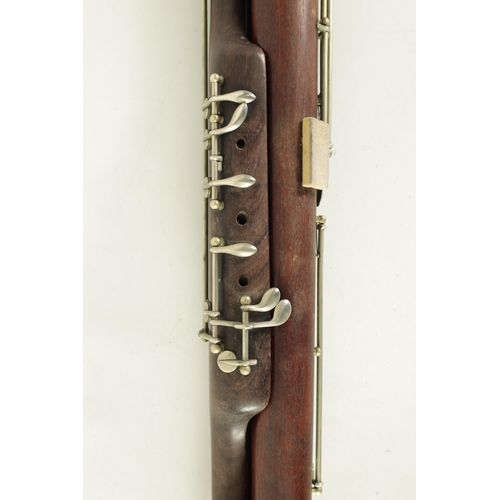 106 - AN EARLY 20TH CENTURY HAWKES & SON LONDON, EXCELSIOR SONORUS CLASS HARDWOOD BASSOON numbered 15491 L... 