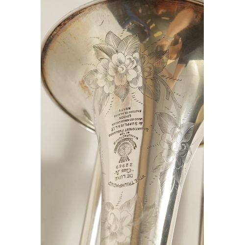 109 - A MID 20TH CENTURY SILVERED BRASS AND BRIGHT CUT MOUNTED CASED TROMBONE with engraved titled floral ... 