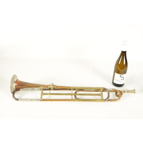 12 - A 19TH CENTURY BRASS, COPPER, AND BRONZE TRUMPET BY GEORGE SMITH with silvered embossed rococo mount... 