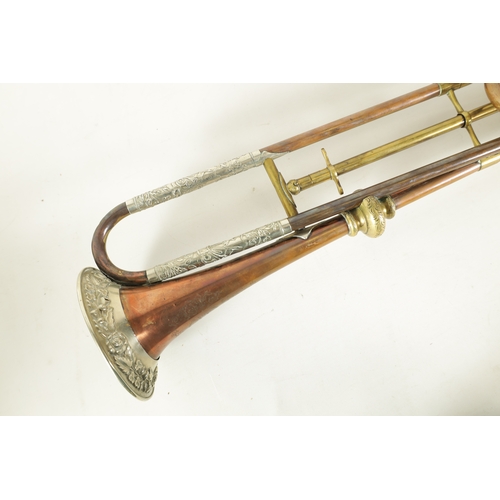 12 - A 19TH CENTURY BRASS, COPPER, AND BRONZE TRUMPET BY GEORGE SMITH with silvered embossed rococo mount... 