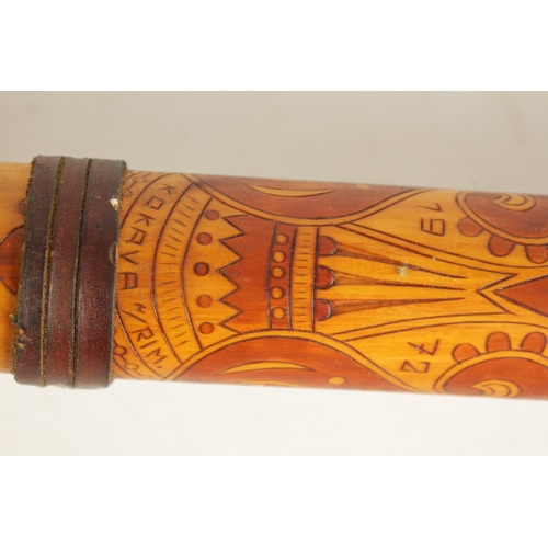 123 - A LARGE SLOVAKIAN FUJARA FLUTE With stained engraved decoration and dated 1972, together with matchi... 