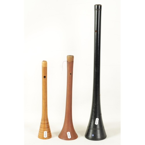 124 - THREE SHAWMS OF VARIED DESIGN comprised of an ebonised ringed design, a plain design double reed, al... 