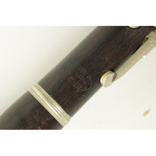 135 - A VINTAGE EBONY MARTIN DARDART CLARINET the turned corked segmented body with metal banded details a... 