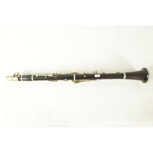 135 - A VINTAGE EBONY MARTIN DARDART CLARINET the turned corked segmented body with metal banded details a... 