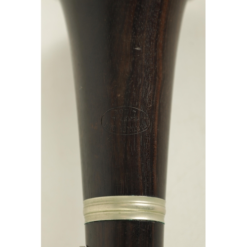 135 - A VINTAGE EBONY MARTIN DARDART CLARINET the turned corked segmented body with metal banded details a... 