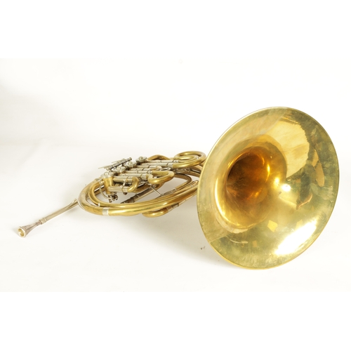 136 - A 20TH CENTURY WELTKLANG BRASS AND SILVERED FRENCH HORN engraved to the bell 