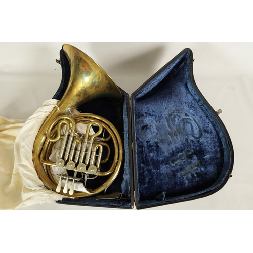 136 - A 20TH CENTURY WELTKLANG BRASS AND SILVERED FRENCH HORN engraved to the bell 