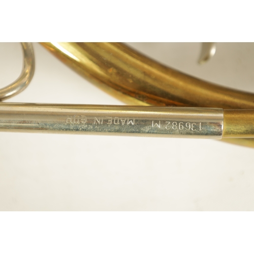 136 - A 20TH CENTURY WELTKLANG BRASS AND SILVERED FRENCH HORN engraved to the bell 