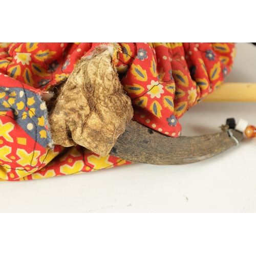 137 - A SET OF MIZOUED TUNISIAN BAGPIPES with horn pipes and leather bag.(39cm overall)