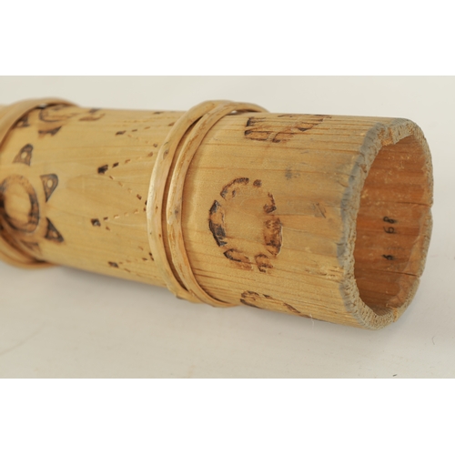 138 - A BAMBOO TAPERING WOOD TRUMPET with scorched ringed decoration.(154cm overall)